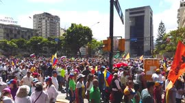 Thousands of Venezuelans march in Caracas to demand humanitarian aid be allowed to enter country