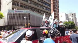 Green helmets in Venezuela march to let humanitarian aid in