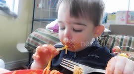 Cute Baby eating Spaghetti and Cheese
