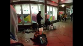 Bucket drummer and fiddler street performance