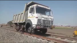 Unique truck fitted to ride rail tracks to transport ballast in India