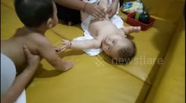 Hilarious baby tries to impress a fairer & cuter baby