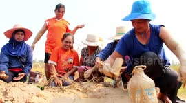 Superstitious villagers drink and bathe in mud they believe has special powers