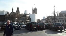 Taxi drivers block Parliament Square in protest