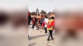 Chinese urban management officer violently smashes old vendor’s cart