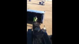 American Airlines staff throw checked bags