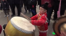 Chinese boy shows off impressive drumming skills at temple fair