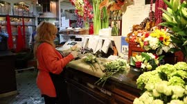 Flower shop workers prepare Valentine’s Day bouquets