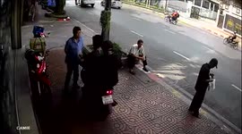 Shocking moment motorcyclist rams into pedestrian who told him not to ride on the pavement