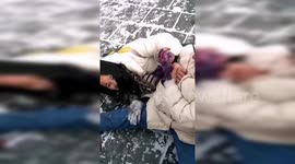 Tourists struggle to walk on slippery snow-covered Great Wall