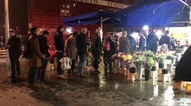 Men lining up for late valentines gift at flower stall