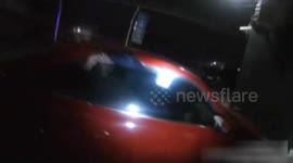 Robber calls police for help after getting arm stuck in car window