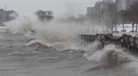 Massive waves crash on shore at Burlington near Toronto in recent severe wind and snow storm making for spectacular and powerful display of the force of nature