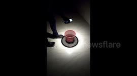 Amazing 3D light show created with just a torch and a bin