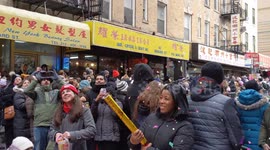 NYC: Spectators shoot firecracker confetti before Chinese New Year parade