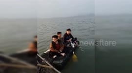 Boys blown out to South China Sea on paddle-board rescued by police