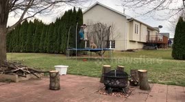 Iowa boy and his dog love jumping on the trampoline together