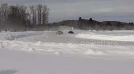 Cars hold rally-style race on frozen ice track in Canadian countryside