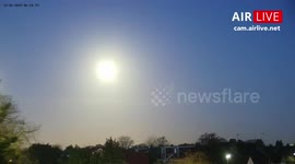 Timelapse of supermoon in front of runway 27R at London Heathrow