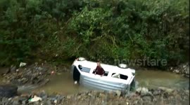 Moment minibus full of passengers tumbles down 30-metre cliff in China's Yunnan