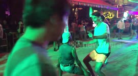 Australian dancing with drag queen in in street of Cambodia