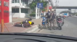 Thai police make young men do press-ups instead of paying traffic fine
