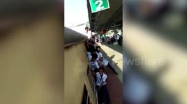 Boys risk life by dangling from moving train in southern India