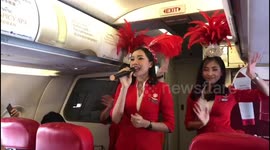 AirAsia hostesses sing safety instructions plane passengers on Valentine's Day