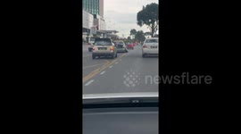 Car driving on 'slanted wheels' seen on the roads of Malaysia