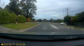 Driver turns off road in front of oncoming traffic on Australian road