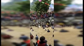 Thousands catch fish with bare hands at annual festival in China’s Fujian
