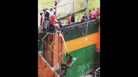Football fans in Indonesia will scale the stadium walls to see their team