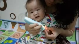 Apparently this baby hates nails cutting