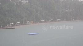 Heavy Rain Results in Deserted Sun Beds and Beaches