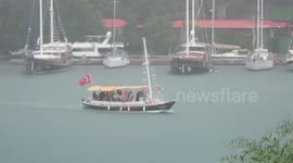 Tourists Caught in Heavy Rain on a Small Shuttle Boat Ferrying from City to Hotel Resort