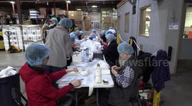 Volunteers From Global medic in Toronto Canada package emergency food aid in Danby Appliance warehouse for people starving in Syria as war in the middle east rages on
