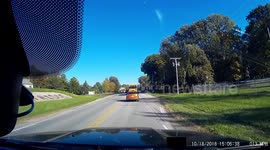 Dashcam - Impatient Driver Passes School Bus with Flashing Lights on Right