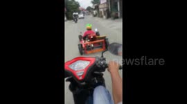Man drives through open traffic in his GO-KART in Indonesia