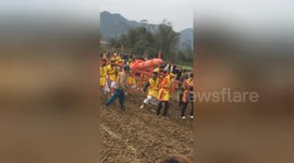 Giant wooden phallus paraded around in Vietnamese fertility festival
