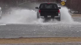Ontario's main roads swallowed by fast moving rivers during storm surge