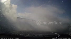 US driver hits snow drift and spins out of control following blizzard warning