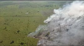 helicopters put out forest fires in Riau, Indonesia by means of water bombs
