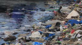 Coastal community in Indonesia leads clean up on beach swamped with garbage