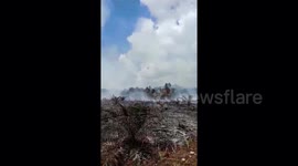 Extinguishing forest and land fires by means of water bombs from helicopters in Riau province, Indonesia