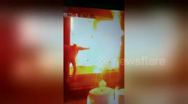 Worker in China nearly consumed by huge fire that bursts out of cotton yarn