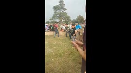 The challenge of Catching a Pig While Blindfolded in a round cage