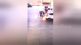 Petrol station workers in China react quickly when car fuel tank ignites at pump