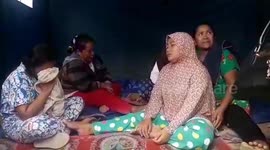 Families in Indonesia wait for news of their loved ones trapped in collapsed mine