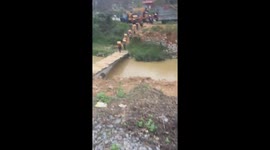 People transport dozens of tons of goods by their backs