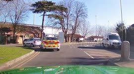 Instant karma as driver pulls out in front of police car only to be pulled over